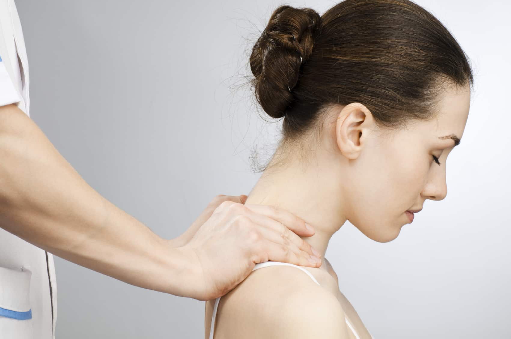 a young beautiful girl is being massaged